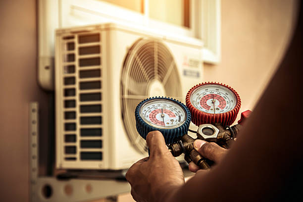 Professional Heat Pump Repair technician working in Westborough, MA